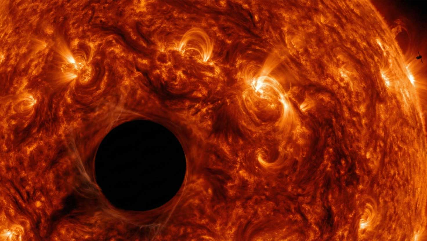 A detailed close up of the Sun showing a strange dark circular region where activity appears unnaturally silent.